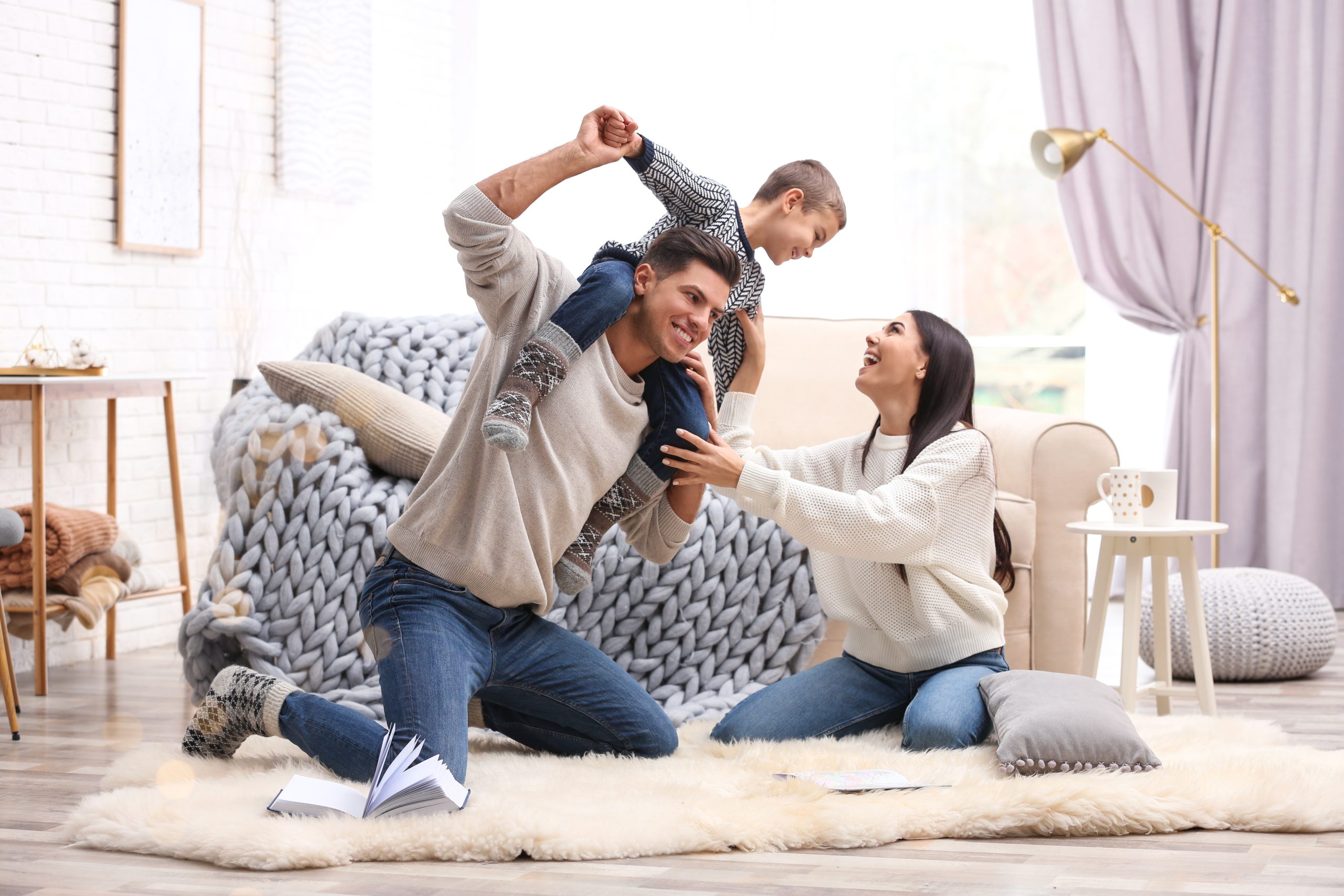 happy family sitting in their new living room .