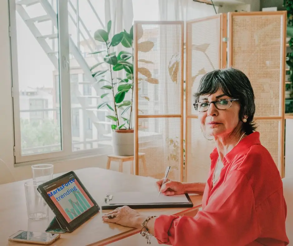 Woman sitting in front of her computer viewing MarksForte website 
