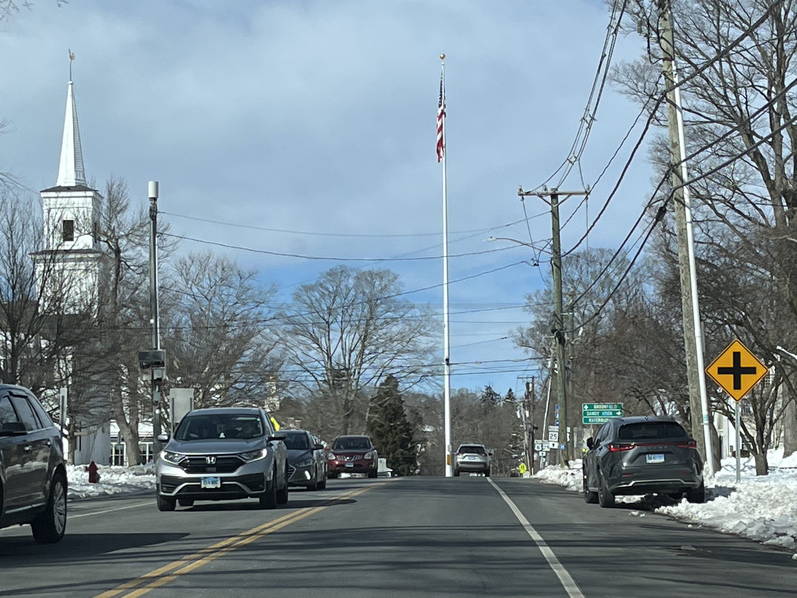 Center of Newtown Ct with Flag pole and Church steeple