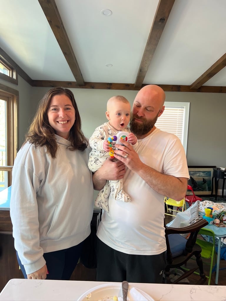 Young couple with their new born in their new home